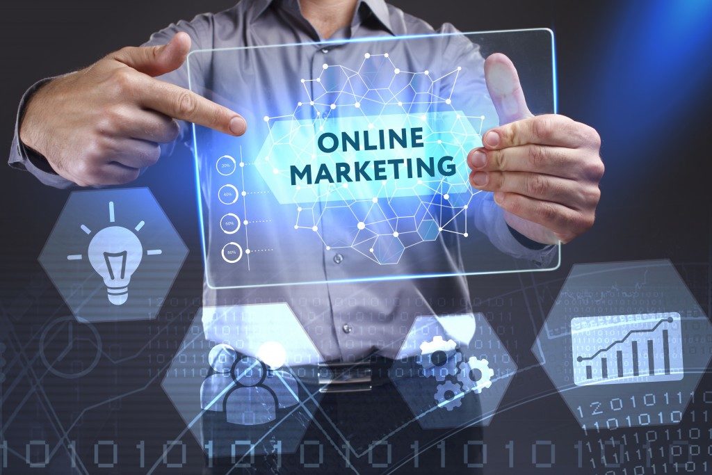 Businessman holding an online marketing sign