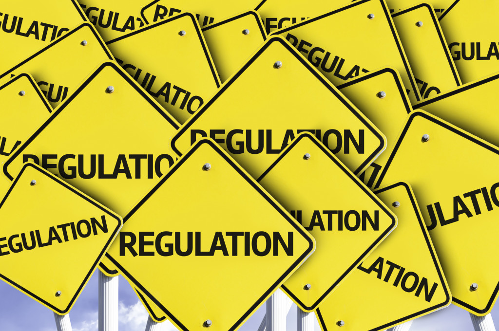 The word REGULATION on yellow road signs
